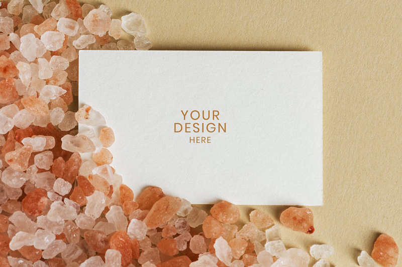 Blank white business card on orange gravel
