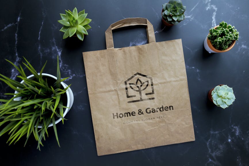 Paper kraft bag with plants mockup RR53VGQ